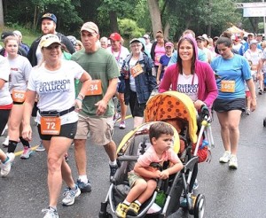 Participants of all ages begin the 5K road race.