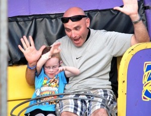 Police Officer Chad Crogan and his son, Caden, 4, take a spin around the 