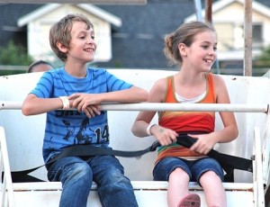 William Murphy, 9, and his sister, Monique, 11, spot their parents while on the Ferris wheel.