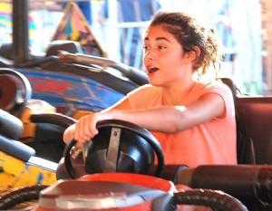 Abby Lopresti, 13, steers her way around in a bumper car.