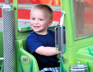Jack Allen, 2, takes his first driving lesson on the 