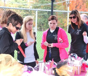(l to r) Michele Duplisea, Meghan Depasquale, Kayla Gill and Alyssa Soule check raffle items.