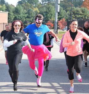 (l to r) Kayley Fannon, George Larassa and Kate Flannigan lead the pack of high-heeled racers.