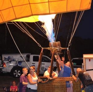 A balloonist lights a burner to create an incandescent glow. Photo/Ed Karvoski Jr. 