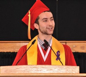 Valedictorian and class co-treasurer Scott Kall encourages classmates to adopt a problem-free philosophy as in “Hakuna Matata” from “The Lion King.” 
