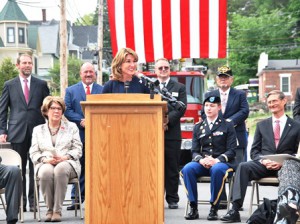 Lt. Gov. Karyn Polito speaks at the podium during the dedication of the Capt. Seth R. Michaud Memorial Bridge. Other participants included (standing, l to r) Selectman Joe Durant, Selectman Jim Quinn, Veterans Agent Brian Stearns, Vinny Giombetti of Disabled Veterans Chapter 82, (seated, l to r) state Rep. Kate Hogan, D-Stow, U.S. Army Capt. Kristen Walls and Selectmen Chair Fred Lucy.