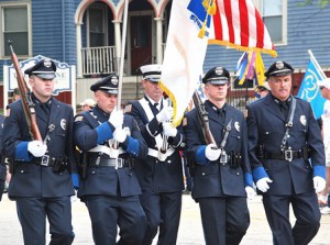The Hudson Police Department Color Guard marches into position at Wood Square for the post-parade ceremony at Liberty Park. 