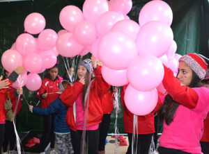 Remembering Michaella under grey skies in pink attire
