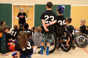 Nancy Hudson talks to the participants of the Unified Basketball Program.