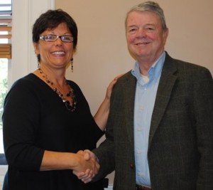 Executive Director Lynne Johnson of the River's Edge Arts Alliance welcomes new Conductor David Bailey. (Photo/submitted)