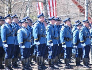 State troopers stand at attention at St. Michael’s Cemetery.