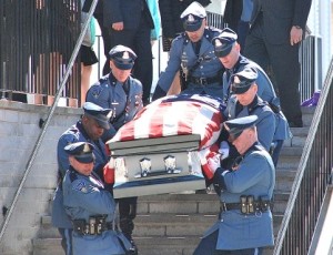 Colleagues of State Trooper Thomas L. Clardy from the Charlton barracks serve as pallbearers.