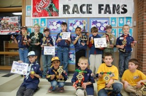 Pack 4 Pinewood Derby winners: (back row, l to r) Ben Vartabedian, Angelina Luongo, Anthony Giombetti, Hunter Holleman, Trevor Catton, Christopher Walsh, Colin Candiloro, and Sean Foley; (front row, l to r) Dalton Burkhart, Neill Rao, Dave Hackett, Alex McCullough, Noah Budiansky, and Lucas Budiansky.