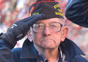 Commander Eugene Hakala of VFW Post 1027 salutes as patriotic music is played. Photos/Ed Karvoski Jr.
