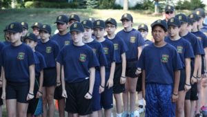 Students at the Hudson Youth Police Academy stand in marching formation. The group was gathered at Mulready Elementary School in Hudson to watch a State Police helicopter land. 