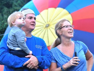 The Sullivan family – (l to r) Ryan, 2, with parents Pat and Beth – watch hot air balloons rise.