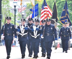 The Hudson Police Color Guard leads the parade. 