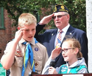 Saying the Pledge of Allegiance are Noah Ortgiesen, 12, of Boy Scout Troop 2; Brooke LaVache, 10, of Girl Scout Troop 75242; and Past Commander Joe Jacobs of American Legion Post 100. 