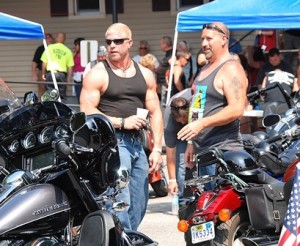 Rod Rousseau and John Wood check out motorcycles before the ride.