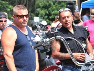 Dave Armstrong and Pete Scobie check out motorcycles before the ride.
