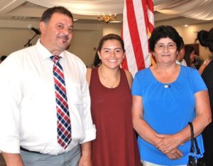 Celina Chaves (center) congratulates (l to r) her uncle, Jose Chaves, and her aunt, Maria Helena Reis, after they became American citizens.