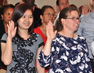 Citizenship candidates repeat the Oath of Allegiance.