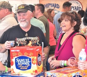 Jeff Shown and Mary Schofield visit the Samuel Adams vendor.