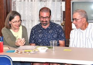 Figuring the answer to a Hudson trivia question are Murphy family members (l to r) Suzanne, their son James, and Lee, collectively known as the “416 Mainers” team.