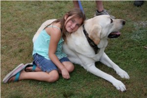 8- year old Falicia from Marlborough has made fast friends with 7- year old Marley, 140 lb yellow Lab.