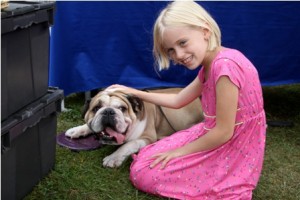 8- year-old Sullivan with her dog Louie, a 5-year- old English Bulldog