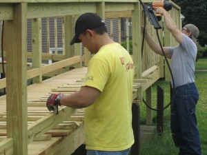 Second Saturday volunteers build a wheelchair ramp. (Photos/submitted)