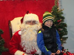 Patrick Susanin meets Santa at Northboro Chiropractic Center’s trolley stop.