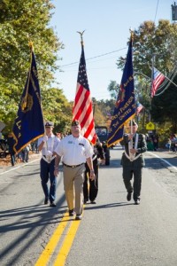 Members of the Military Veterans Color Guard carry the flag in the parade.