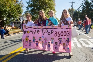 Members of Southborough Girl Scouts Brownie Troop 85003 proudly display their banner.