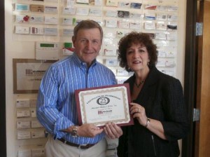 Ernest Kapopoulos of Hudson, president of the Board of Directors of the Addiction Referral Center (ARC) of Marlborough, receives a certificate for 25 years membership in the Greater Marlborough Chamber of Commerce recently from Chamber President Susan Morreale Leeber. (Photo/submitted)