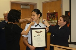 (l to r) - Lt. Col. Ralph Shaver, Cadet Zhang's mother Juanzhi Liu, Cadet 2nd Lt. Beatrice Zhang, and Maj.  Photo/ 2nd Lt. Joshua Bell 