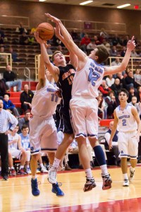 Marlborough’s Joe Tirpak tries to squeeze between double coverage to get a shot off.
