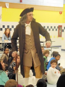 Kyle Blanchette portrays Benjamin Franklin for the third-graders at Kane Elementary.