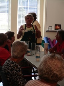 The art of arranging dahlias and hydrangeas was demonstrated by Colonial Garden Club member Holly Evangelous. 