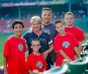 Debbie and Mark Whitmore with their four boys at a Red Sox game Photo/submitted 