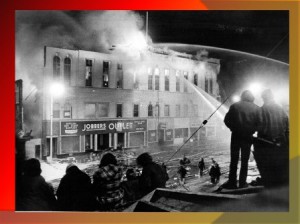Firefighters fight the blaze that destroyed three Main Street buildings in December 1975. (Photo/submitted)