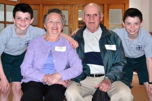 Carol and Eugene Mauro (center) are joined by their twin grandsons, fourth-graders Nathan (left) and Thomas Crisafulli (right), while visiting Immaculate Conception School for Grandparents Day. Photo/Ed Karvoski Jr. 