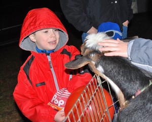 Alex Ayres, 6, shares his popcorn with a live goat.