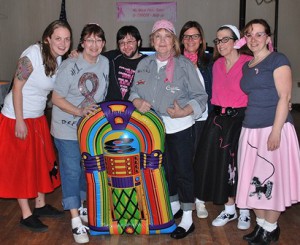 Gathered around the jukebox are Hot Walkers’ team captain Pauline Smith (center) with some Team Vikki members (l to r) Jen Geary, captain Vikki Crowley, CJ Wood, Patty Izbicki, Joyce Mara and Kelly Holbrook.