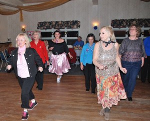 (l to r) Mary Dragon leads a line-dance routine with Linda Dumalac, Cristy Bull, Elaine Toranto, Colleen Ryder and Diane Bilodeau.