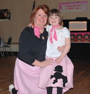 Stacy Reynolds and her daughter Emma, 5, sport matching poodle skirt.