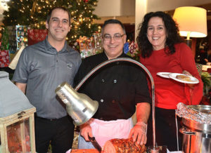 Serving guests at the 2017 Evening of Giving from Marlborough Country Club are (l to r) Ben Wachter, Dino Ferretti and Betty Remillard.File photo/Ed Karvoski Jr.
