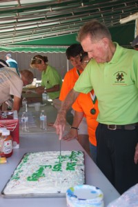 Pat Forrest cuts the cake to celebrate his upcoming 79th birthday. 