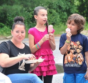 (l to r) Veronica Vojackova, her daughter Maya, 9, and her stepson Anthony Ross, 8, enjoy snacks.