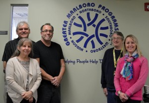 “Helping People Help Themselves” reads the sign at the entrance to the offices of Greater Marlboro Programs, Inc. (l to r) Bill Fagan, assistant director of family support; Nanette Goldstein, director of family and individual support; Bob Begg, respite staff; Wayne Larrabee, client; and Denise Vojackova-Karami, vice president of developmental services. (Photo/submitted)